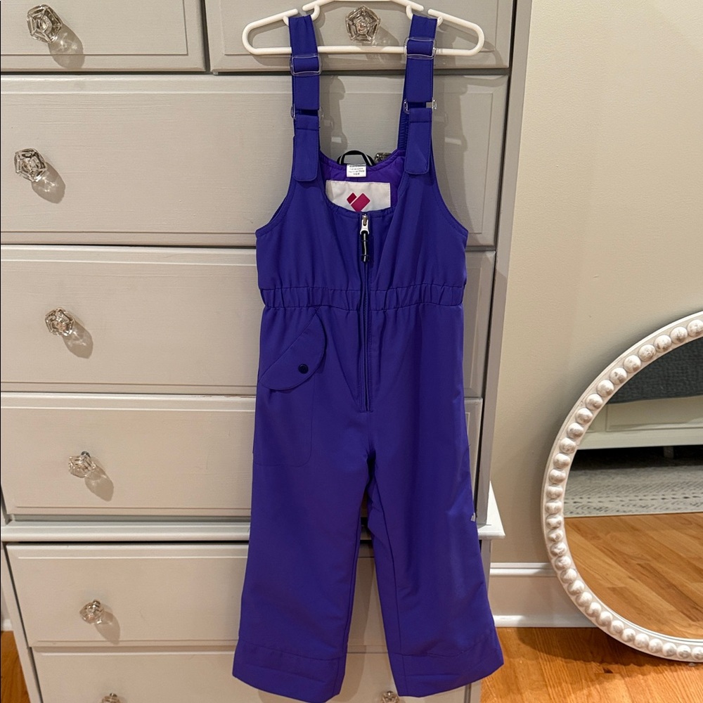 Obermeyer Kids One Piece in Vibrant Purple with matching fox skin jacket